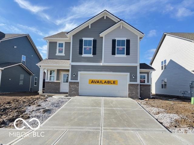 front of property with a garage