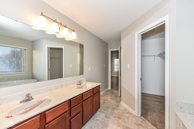 bathroom with a bathing tub and vanity