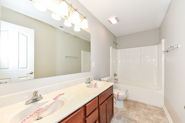 full bathroom featuring vanity, shower / bath combination, and toilet