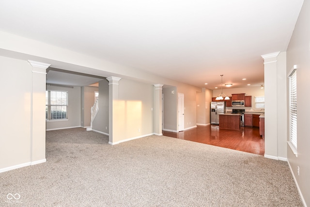 unfurnished living room featuring dark wood-type flooring