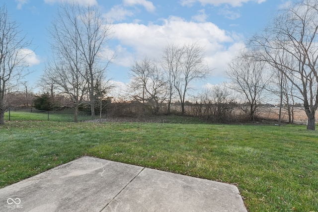 view of yard featuring a rural view and a patio area