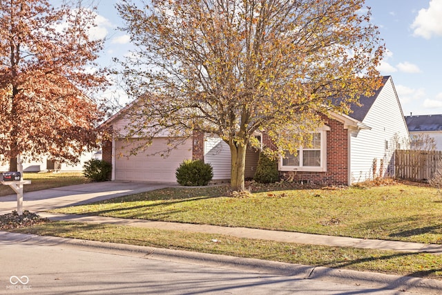 view of property hidden behind natural elements with a garage and a front lawn