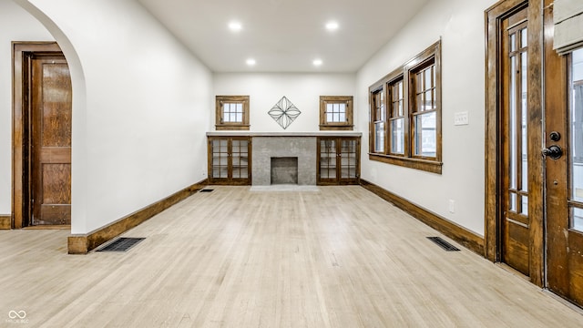 unfurnished living room featuring light wood-type flooring