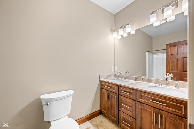 bathroom with a shower, vanity, and toilet