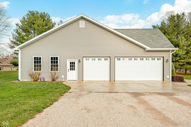 view of property exterior with a yard and a garage