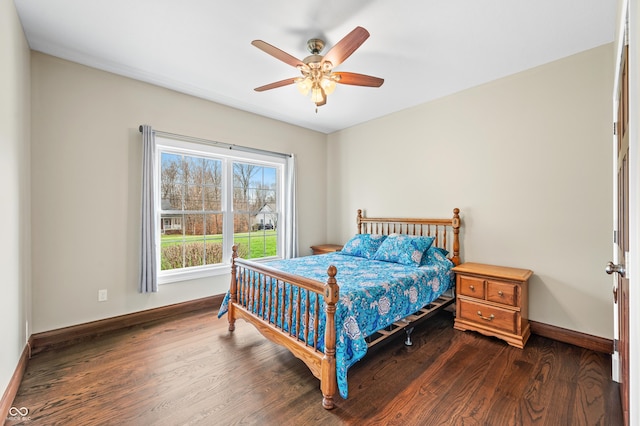 bedroom featuring ceiling fan and dark hardwood / wood-style flooring