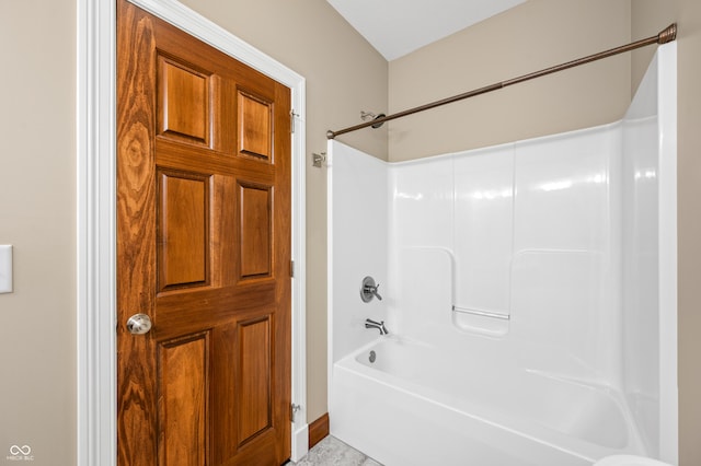 bathroom with shower / bathing tub combination and tile patterned flooring