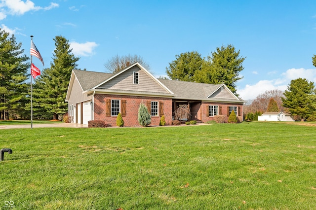 view of front of house with a garage and a front yard