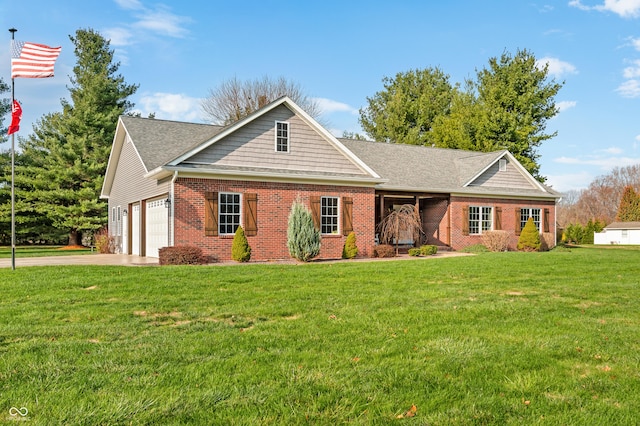 view of front of property with a garage and a front lawn