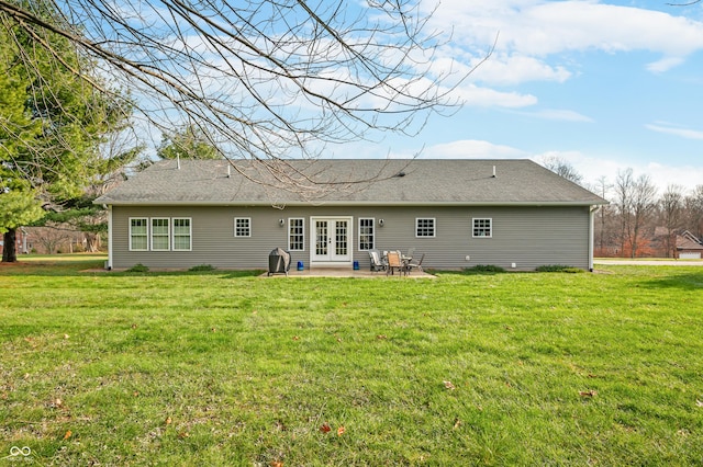 back of house featuring a patio area, a yard, and french doors