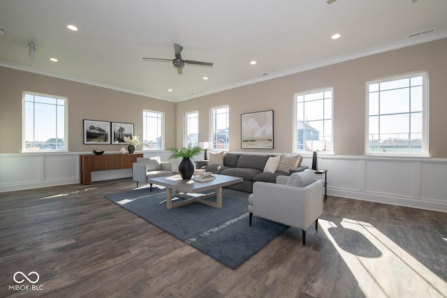 5607 Tart Blvd, Indianapolis, IN 46239 - living room featuring crown molding, dark wood-style flooring, a decorative wall, a ceiling fan, and a wainscoted wall