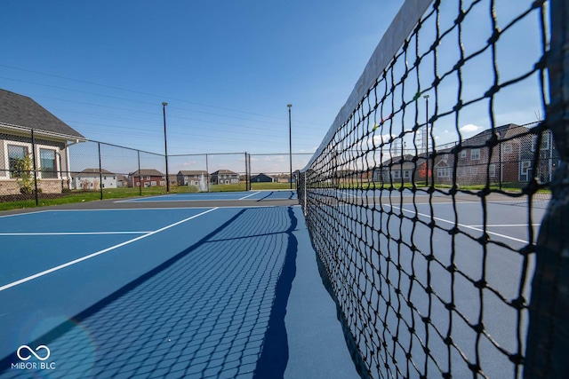 5607 Tart Blvd, Indianapolis, IN 46239 - view of tennis court featuring a residential view