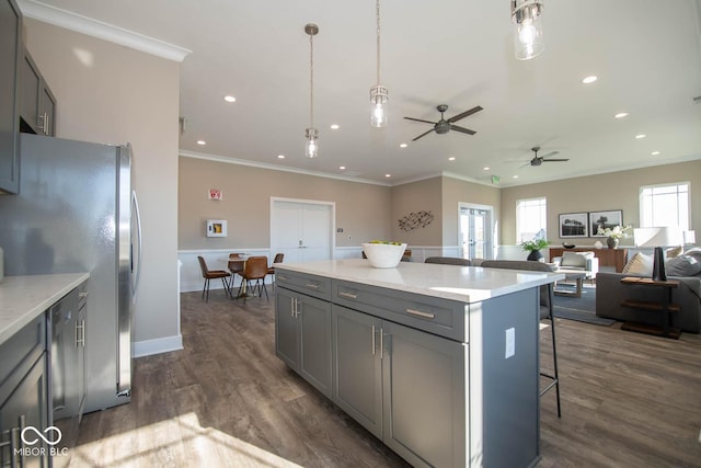 5607 Tart Blvd, Indianapolis, IN 46239 - kitchen with gray cabinetry, a kitchen breakfast bar, recessed lighting, stainless steel refrigerator with ice dispenser, and open floor plan