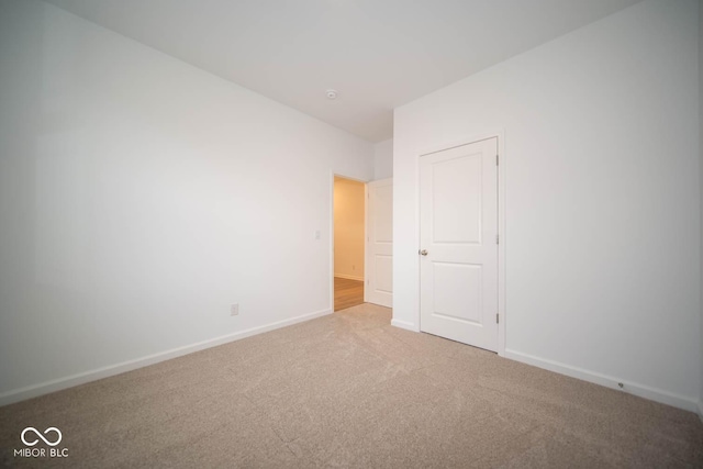 5607 Tart Blvd, Indianapolis, IN 46239 - unfurnished bedroom featuring carpet floors and baseboards