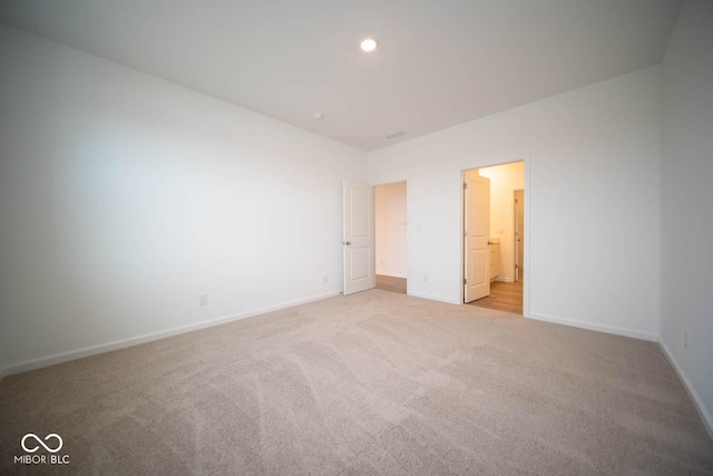 5607 Tart Blvd, Indianapolis, IN 46239 - unfurnished bedroom featuring light carpet and ensuite bath