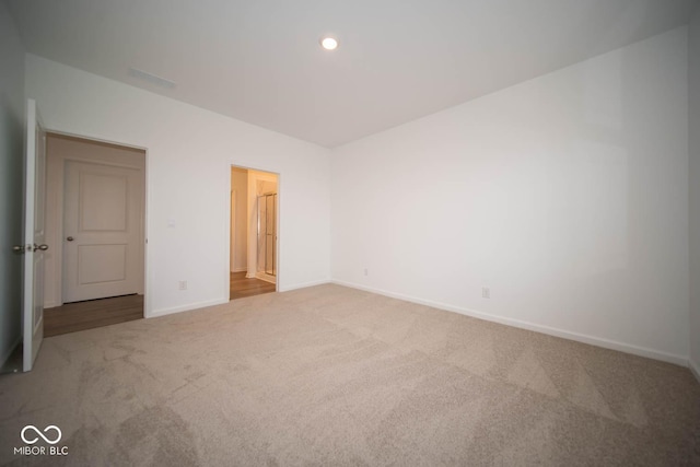 5607 Tart Blvd, Indianapolis, IN 46239 - unfurnished bedroom with carpet flooring and recessed lighting