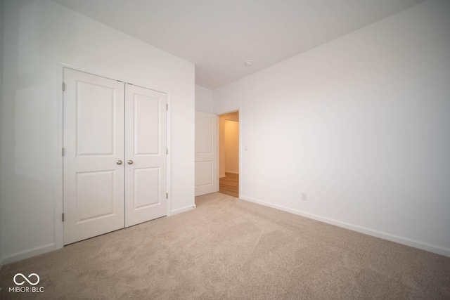 5607 Tart Blvd, Indianapolis, IN 46239 - unfurnished bedroom featuring carpet and a closet