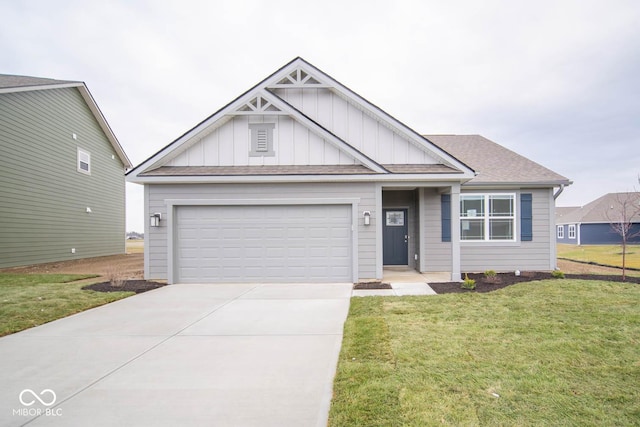 view of front of home with a front lawn and a garage