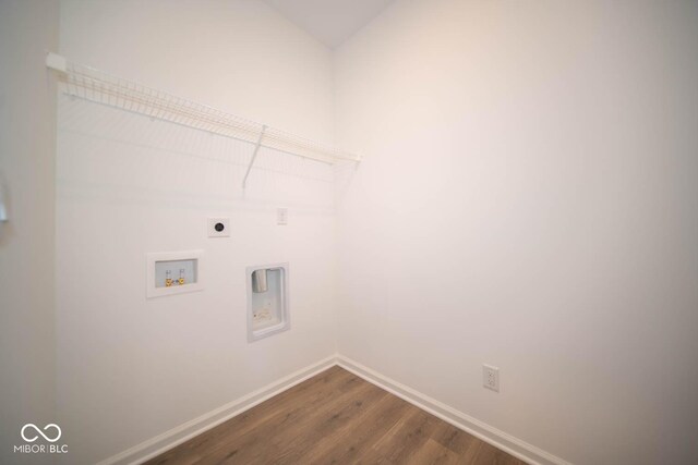5607 Tart Blvd, Indianapolis, IN 46239 - washroom with hookup for an electric dryer, dark wood finished floors, and hookup for a washing machine
