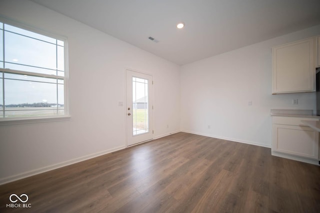 5607 Tart Blvd, Indianapolis, IN 46239 - empty room with dark wood-type flooring and recessed lighting