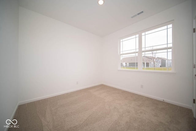 5607 Tart Blvd, Indianapolis, IN 46239 - carpeted empty room with baseboards and recessed lighting