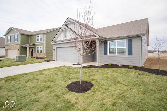 5607 Tart Blvd, Indianapolis, IN 46239 - view of front facade featuring concrete driveway, an attached garage, a front lawn, and roof with shingles