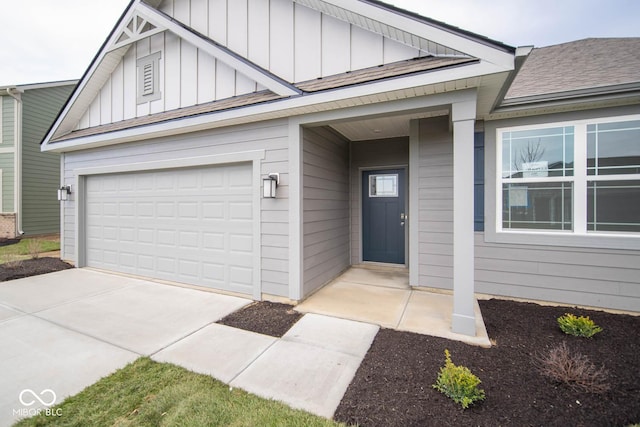 5607 Tart Blvd, Indianapolis, IN 46239 - view of front of home featuring board and batten siding, a garage, concrete driveway, and roof with shingles