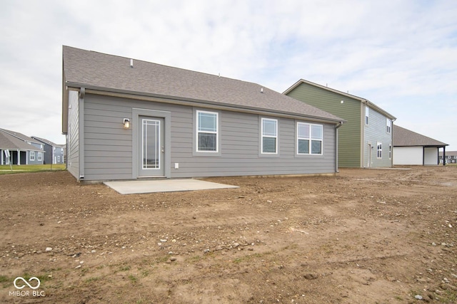 5607 Tart Blvd, Indianapolis, IN 46239 - back of house with a patio area and roof with shingles