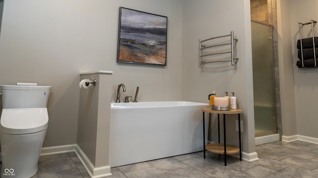 bathroom featuring shower with separate bathtub and toilet