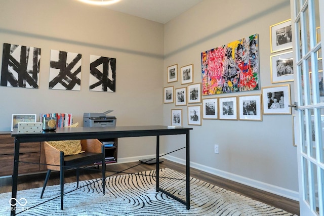 home office with wood-type flooring