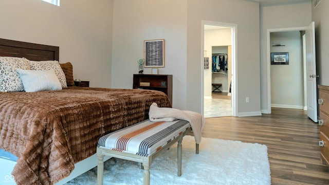 bedroom with dark wood-type flooring