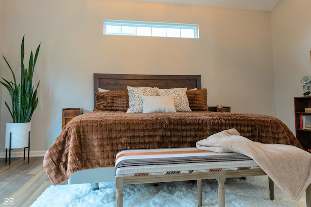 bedroom with wood-type flooring