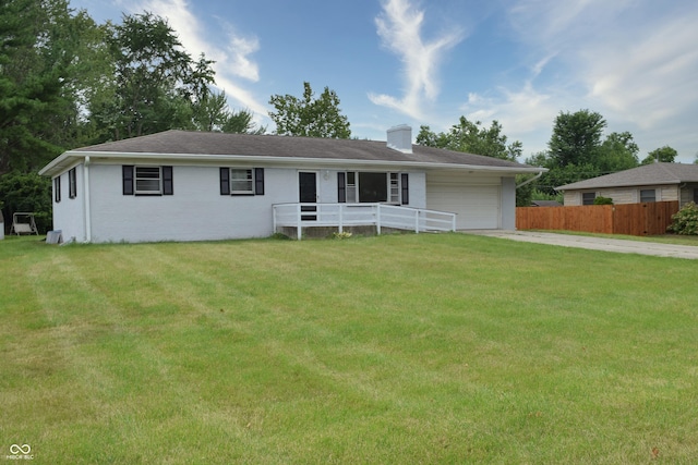 single story home with a front lawn and a garage