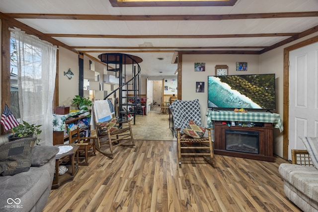 living room featuring beam ceiling and wood-type flooring