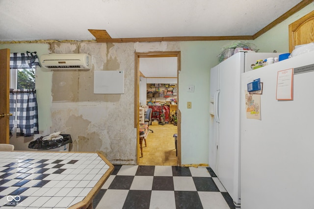 kitchen featuring an AC wall unit, tile countertops, white fridge with ice dispenser, and ornamental molding