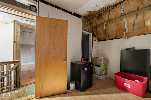 basement featuring light hardwood / wood-style floors