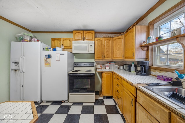 kitchen featuring tile countertops, white appliances, backsplash, sink, and ornamental molding