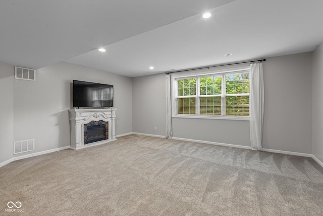 10346 Strongbow Rd, Fishers, IN 46040 - unfurnished living room featuring a fireplace, carpet floors, and recessed lighting