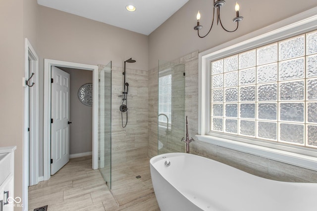 10346 Strongbow Rd, Fishers, IN 46040 - full bathroom with a walk in shower, a freestanding bath, and a chandelier