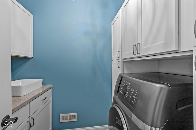 10346 Strongbow Rd, Fishers, IN 46040 - laundry area featuring washer / clothes dryer and cabinet space