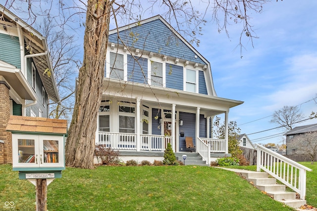 view of front of house featuring covered porch and a front yard