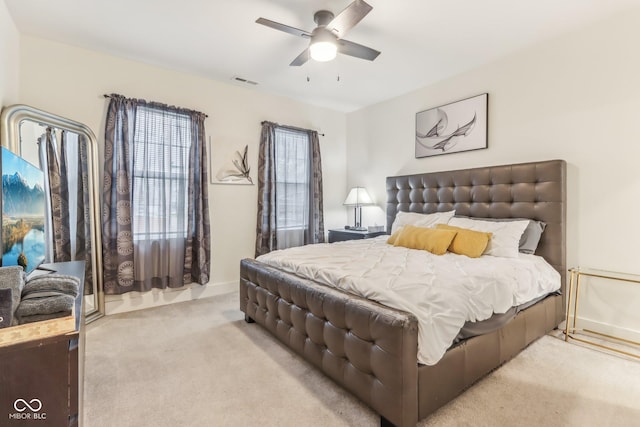 bedroom featuring ceiling fan and light colored carpet