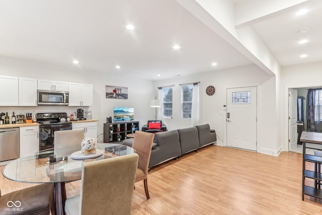 dining area with light hardwood / wood-style flooring