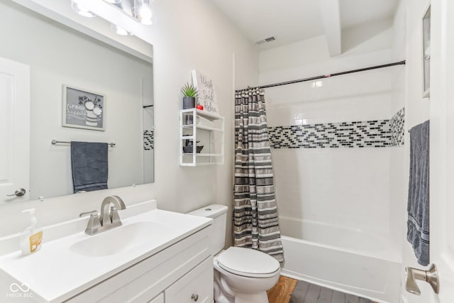 full bathroom featuring vanity, shower / bathtub combination with curtain, wood-type flooring, and toilet