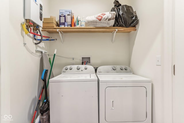 359 Terrace Ave, Indianapolis, IN 46225 - washroom featuring water heater, laundry area, and washer and clothes dryer