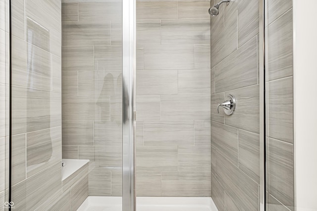 bathroom with tiled shower