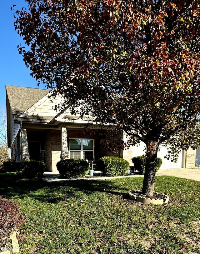 view of side of property featuring a yard