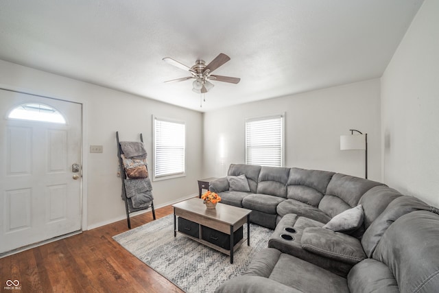 living room with hardwood / wood-style floors and ceiling fan