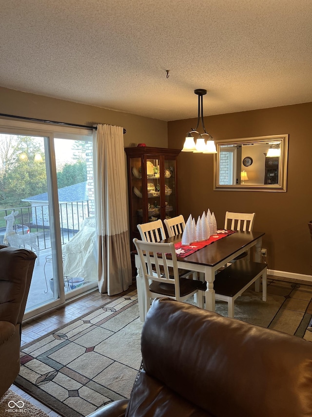 dining area with a textured ceiling