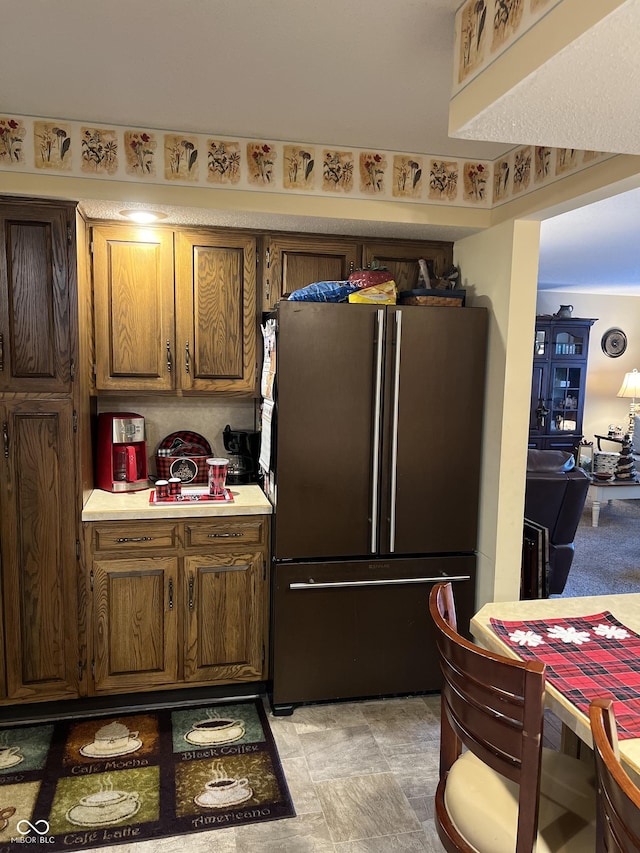 kitchen featuring stainless steel refrigerator